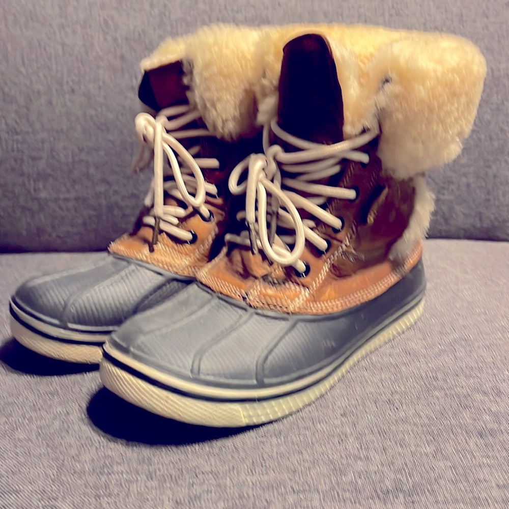 Crocs brown leather, waterproof, fur lined boots.